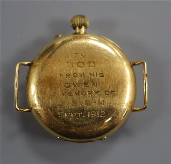 A gentlemans early 20th century 18ct gold manual wind wrist watch, with Roman dial and case back inscription,